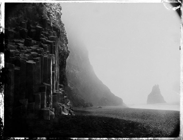 Rainy day at Reynisfjara black sand beach - south coast Iceland - sea stacks and columnar basalt - fine art polaroid photography by Guðmundur Óli Pálmason - Kuggur.com